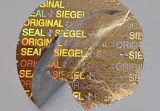 Hologrammetikett in kupfer mit vollflächigem Sicherheitsklebstoff